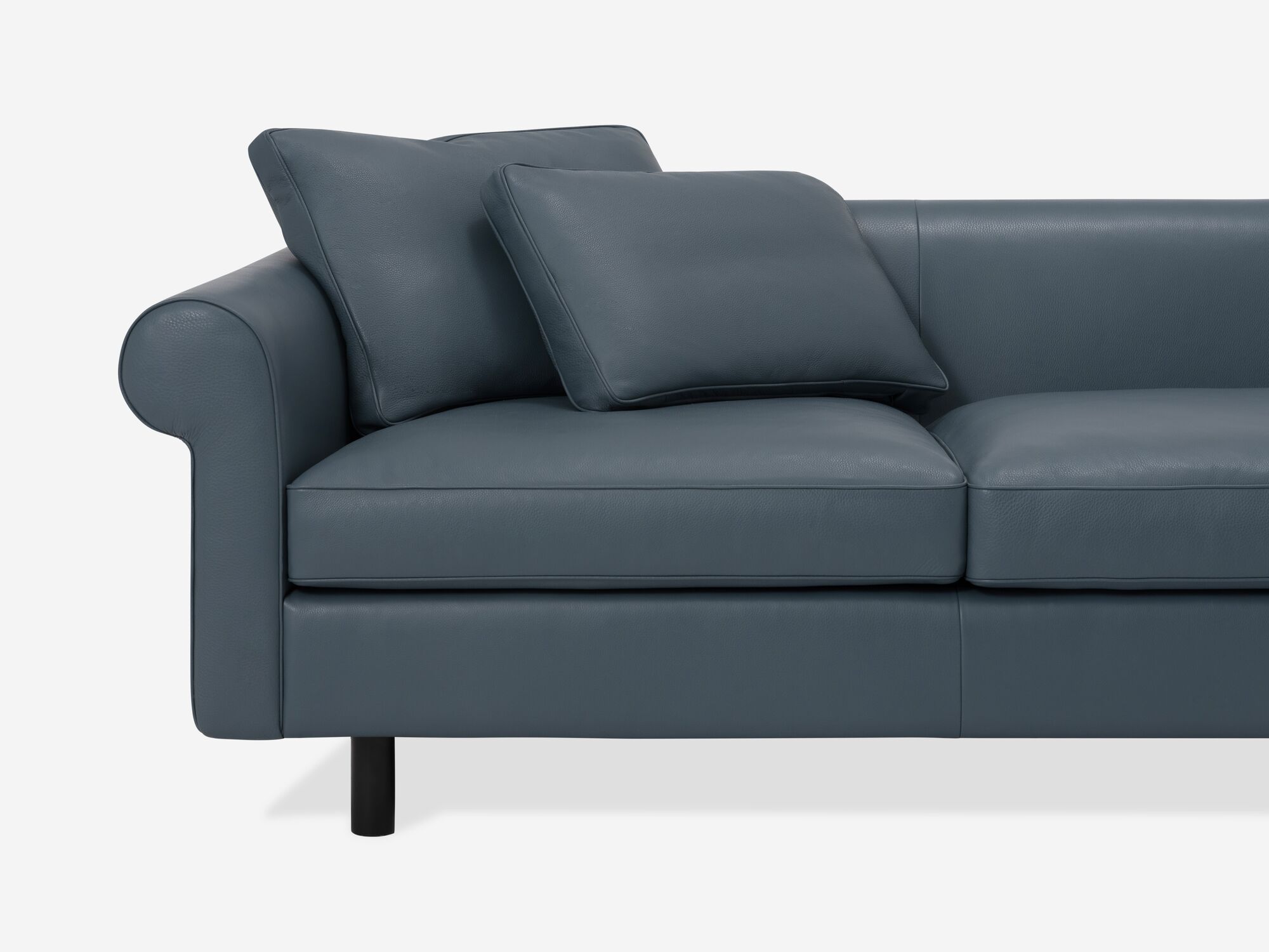 Front detail view of blue leather sectional sofa